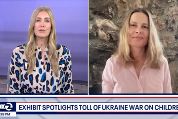 Newscast featuring 2 speakers and the caption "Exhibit spotlights toll of Ukraine war on children"